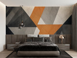Modern geometric wallpaper in stylish living room with grey sofa and orange accents