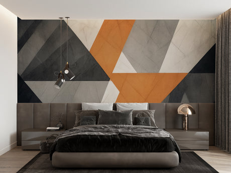 Modern geometric wallpaper in stylish living room with grey sofa and orange accents