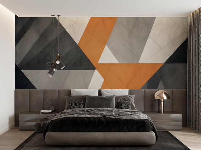 Modern geometric wallpaper in stylish living room with grey sofa and orange accents