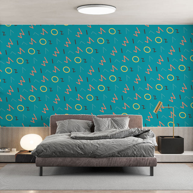 Modern geometric wallpaper in a bright home office space, showing coral and yellow pattern creating an energetic workspace atmosphere