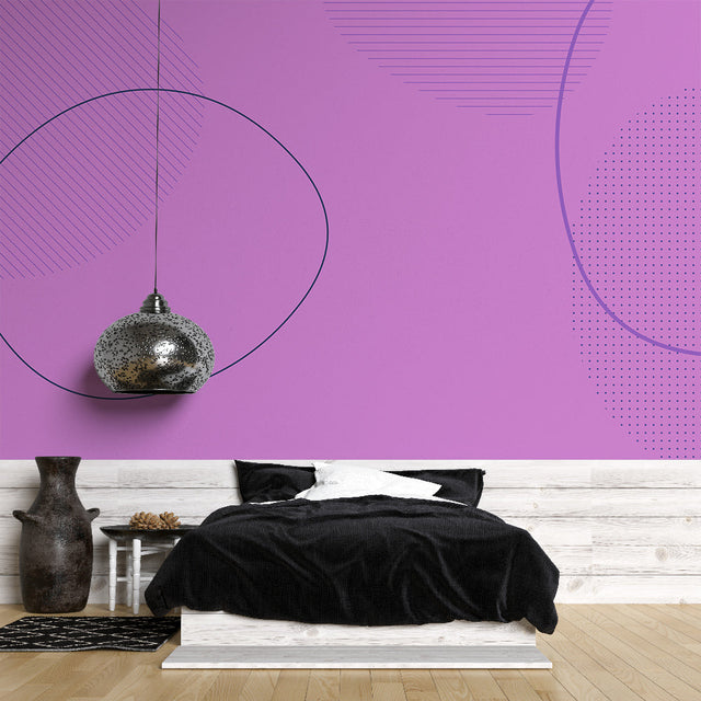 Modern purple geometric wallpaper mural creating depth in a minimalist living room with grey furniture