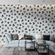Modern geometric triangle wallpaper in blue tones bringing fresh style to a minimalist home office setup