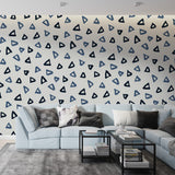 Modern geometric triangle wallpaper in blue tones bringing fresh style to a minimalist home office setup