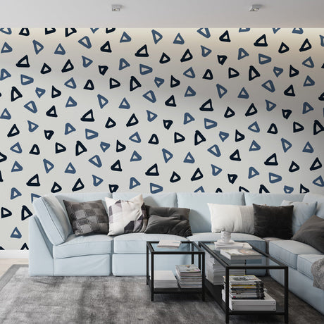 Modern geometric triangle wallpaper in blue tones bringing fresh style to a minimalist home office setup