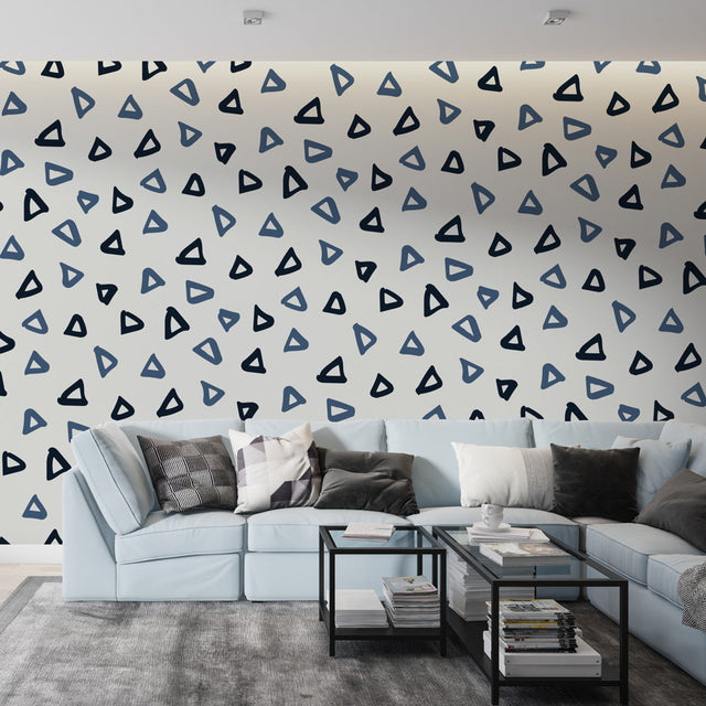 Modern geometric triangle wallpaper in blue tones bringing fresh style to a minimalist home office setup