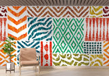 Tribal pattern wallpaper bringing color to dining room with wooden furniture