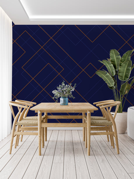 Navy blue and gold geometric wallpaper in modern living room with grey sofa and brass accents
