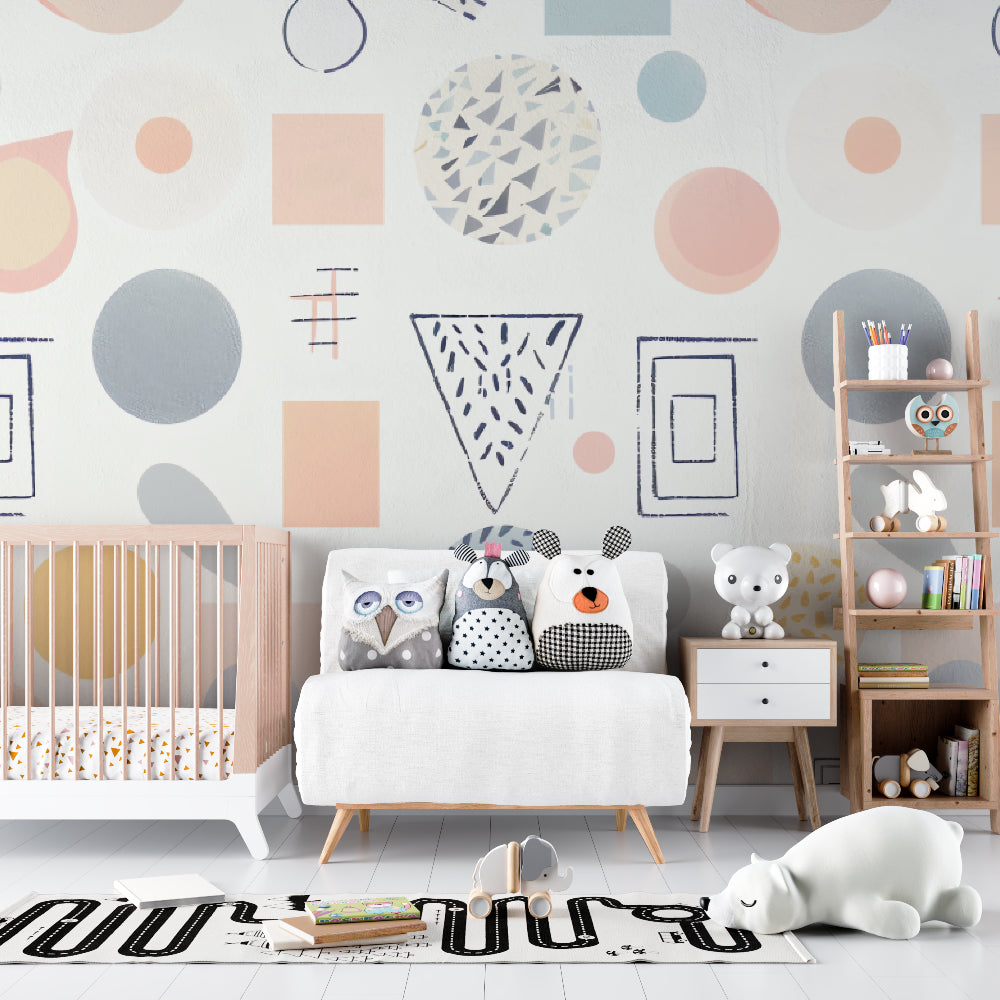 Geometric nursery wallpaper with pastel shapes brightening a modern baby room with white furniture