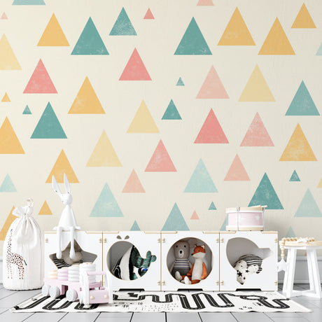 Geometric triangle wallpaper in modern nursery showing soft pastel pattern creating a calm and playful atmosphere