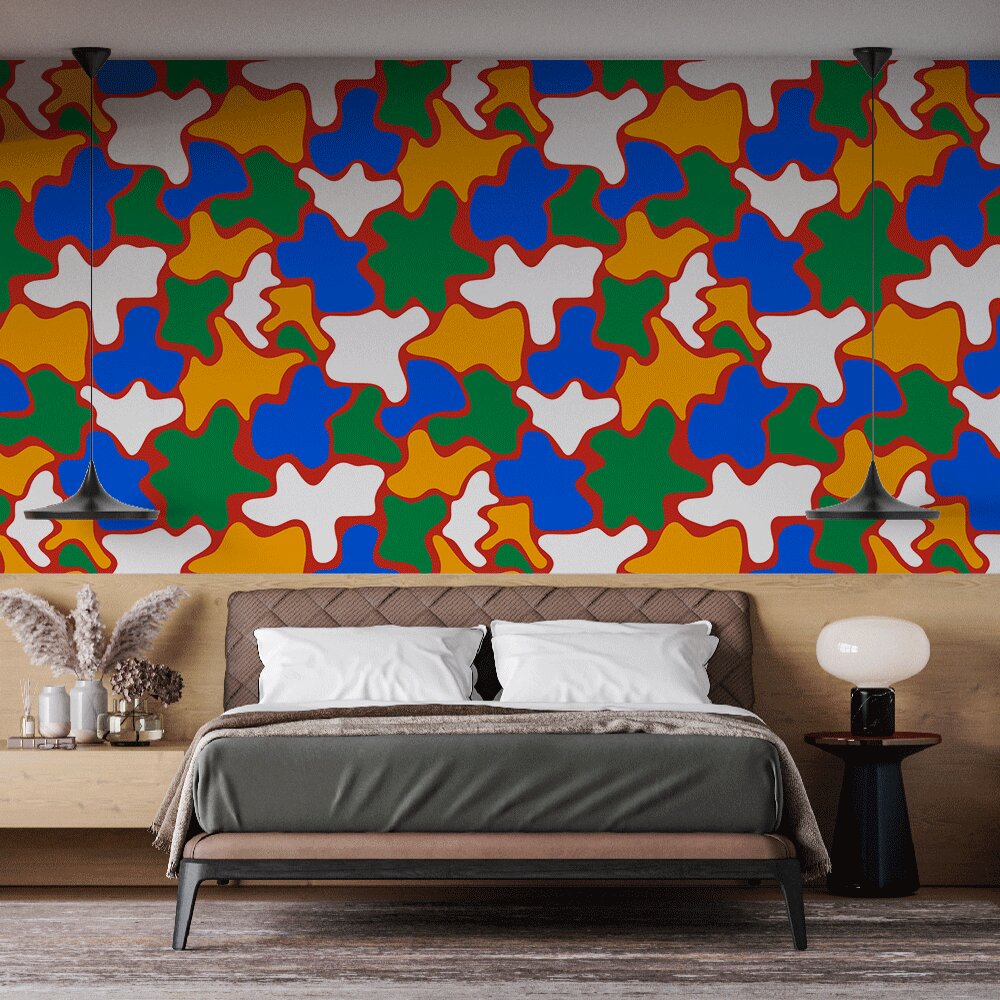 Geometric pattern wallpaper bringing vibrant energy to a modern living room with colorful puzzle shapes and bold lines