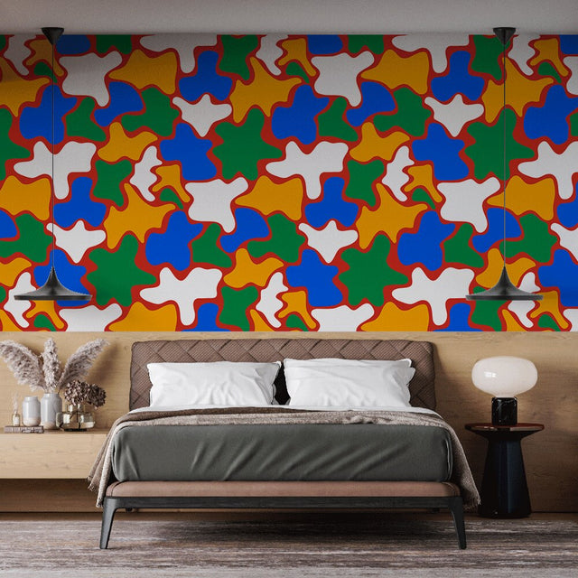 Geometric pattern wallpaper bringing vibrant energy to a modern living room with colorful puzzle shapes and bold lines