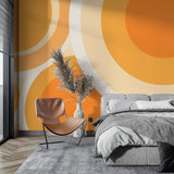 Orange circle wallpaper creating a feature wall in a dining room