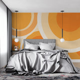 Geometric pattern wallpaper adding warmth to a bedroom setting