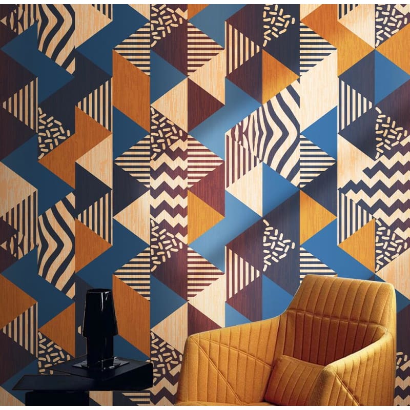 Geometric pattern wallpaper bringing retro charm to a modern living room with blue and orange accents