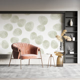 Modern geometric wallpaper with soft green circles brightening a minimalist living room
