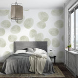 Green geometric wallpaper enhancing a clean Scandinavian bedroom