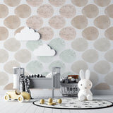 Reading nook with geometric circle wallpaper highlighting the soft pastel color blend