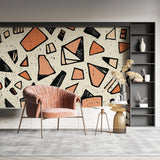 Terracotta geometric wallpaper in home office with minimalist furniture