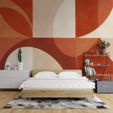 Geometric terracotta wallpaper mural in modern living room with mid-century furniture