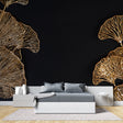 Black and gold Ginkgo leaf wallpaper in modern living room setting