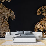 Black and gold Ginkgo leaf wallpaper in modern living room setting