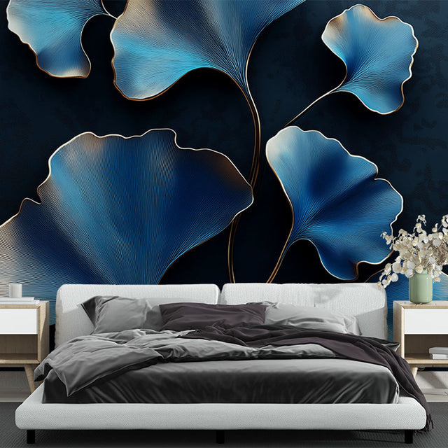 Blue and gold Ginkgo art deco wallpaper in a modern dining room with pendant lighting and dark furniture