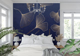 Gold leaf wallpaper accent wall in home office with modern desk setup