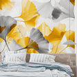 Modern Ginkgo leaf wallpaper in bright living room with grey sofa and natural light