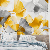 Modern Ginkgo leaf wallpaper in bright living room with grey sofa and natural light