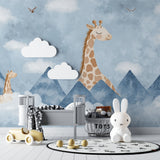 Children's study area featuring whimsical giraffe mountain mural, creating inspiring learning space