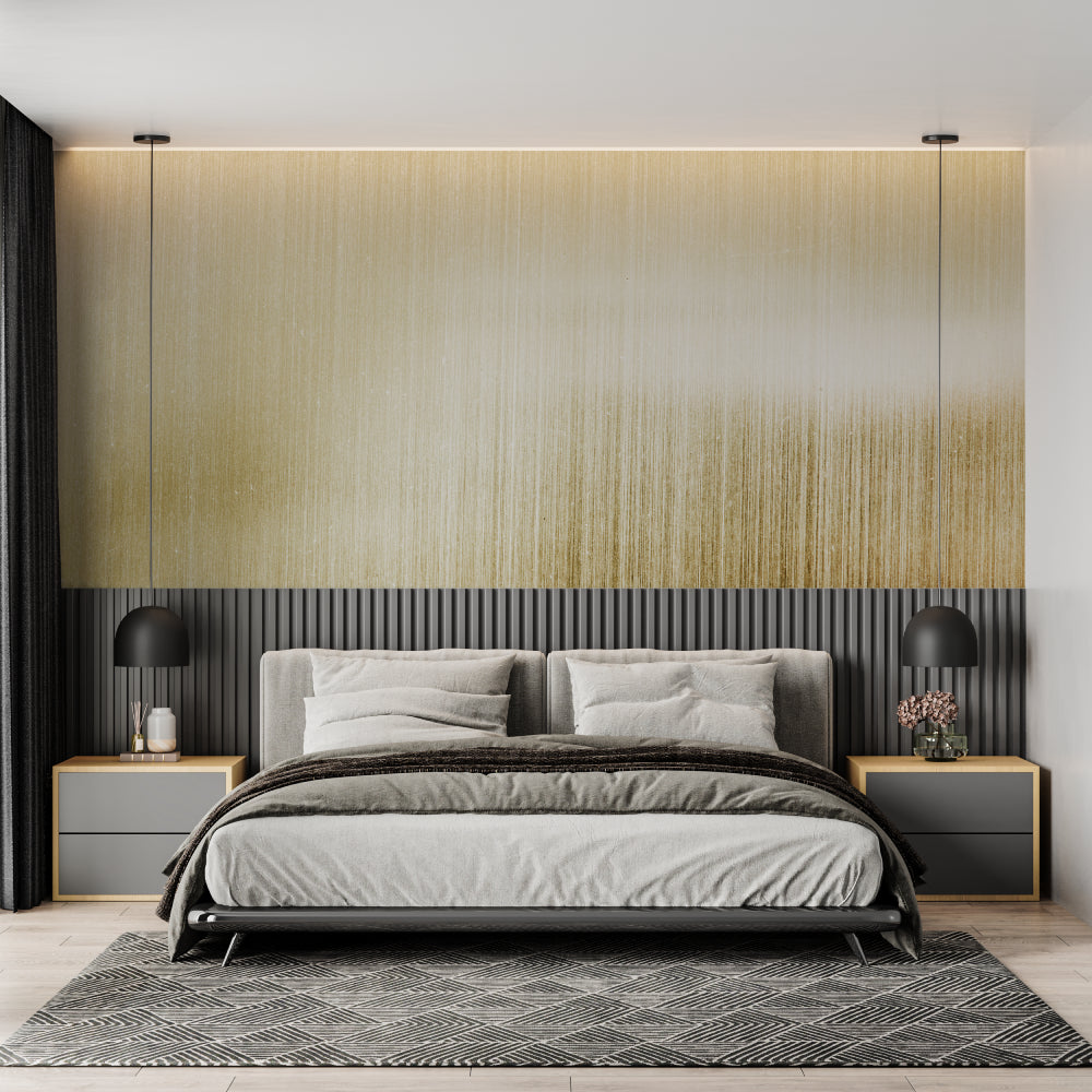 Brushed gold accent wall in master bedroom with soft lighting effects