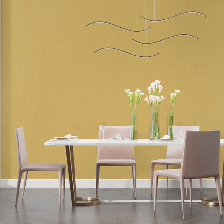 Gold wallpaper mural showcased in a modern living room with tall windows and contemporary furniture