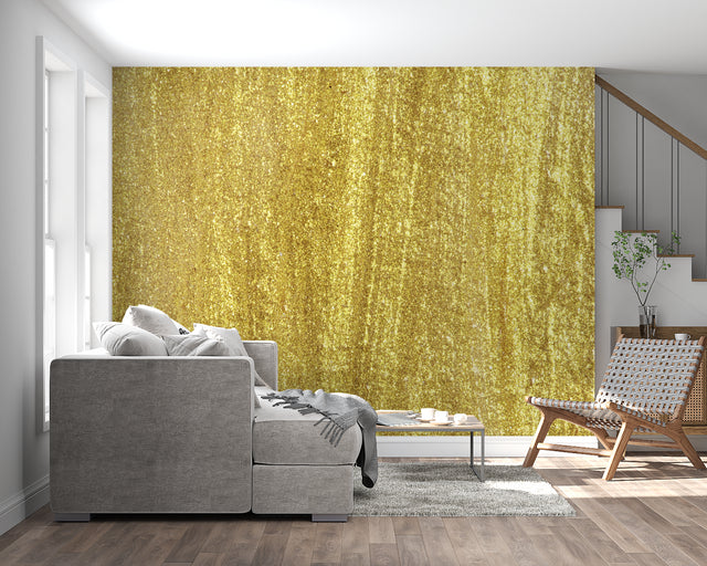 Gold metallic textured wallpaper creating a luxurious atmosphere in a modern living room