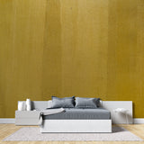 Modern gold textured wallpaper in dining room with chandelier