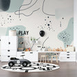 Graffiti wallpaper in modern living room showing vibrant street art design with turquoise and pink tones