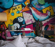 Graffiti street art wallpaper bringing urban style to a modern teen bedroom with colorful musical elements