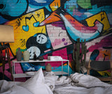 Graffiti street art wallpaper bringing urban style to a modern teen bedroom with colorful musical elements