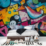 Street art mural wallpaper adding character to a gaming room with bold graffiti style