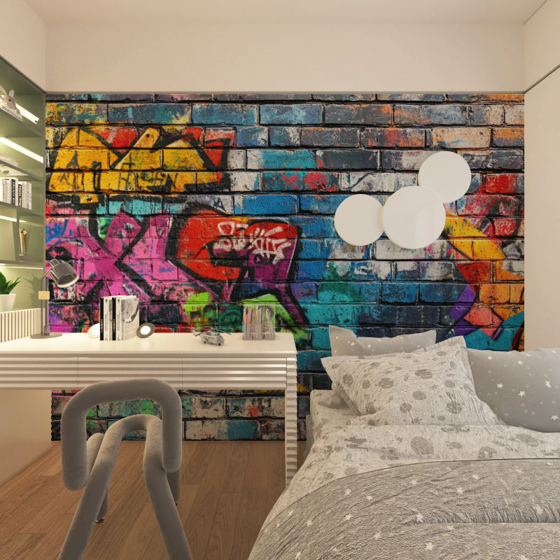 Street art graffiti wallpaper creating bold impact in modern living room with grey sofa