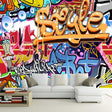 Graffiti wallpaper bringing urban style to a modern living room with bold orange and blue street art design