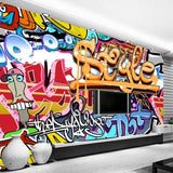 Teen bedroom featuring vibrant street art wallpaper with dynamic graffiti elements