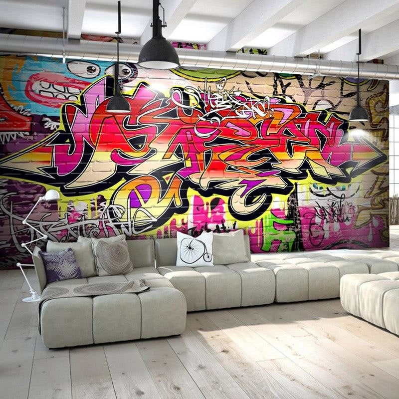 Modern living room with vibrant Graffiti Wall Mural creating an urban artistic focal point behind a minimalist sofa