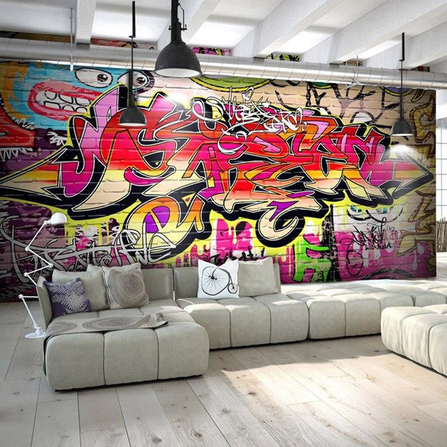 Modern living room with vibrant Graffiti Wall Mural creating an urban artistic focal point behind a minimalist sofa