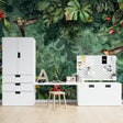 Street art graffiti wallpaper bringing urban style to a modern living room with colorful accent furniture
