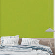 Fresh green wall mural in modern living room with natural light highlighting the apple-green tones