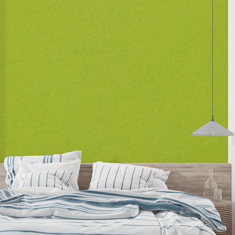 Fresh green wall mural in modern living room with natural light highlighting the apple-green tones