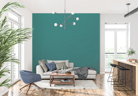 Modern emerald green wall mural in bright living room with white sofa and natural light