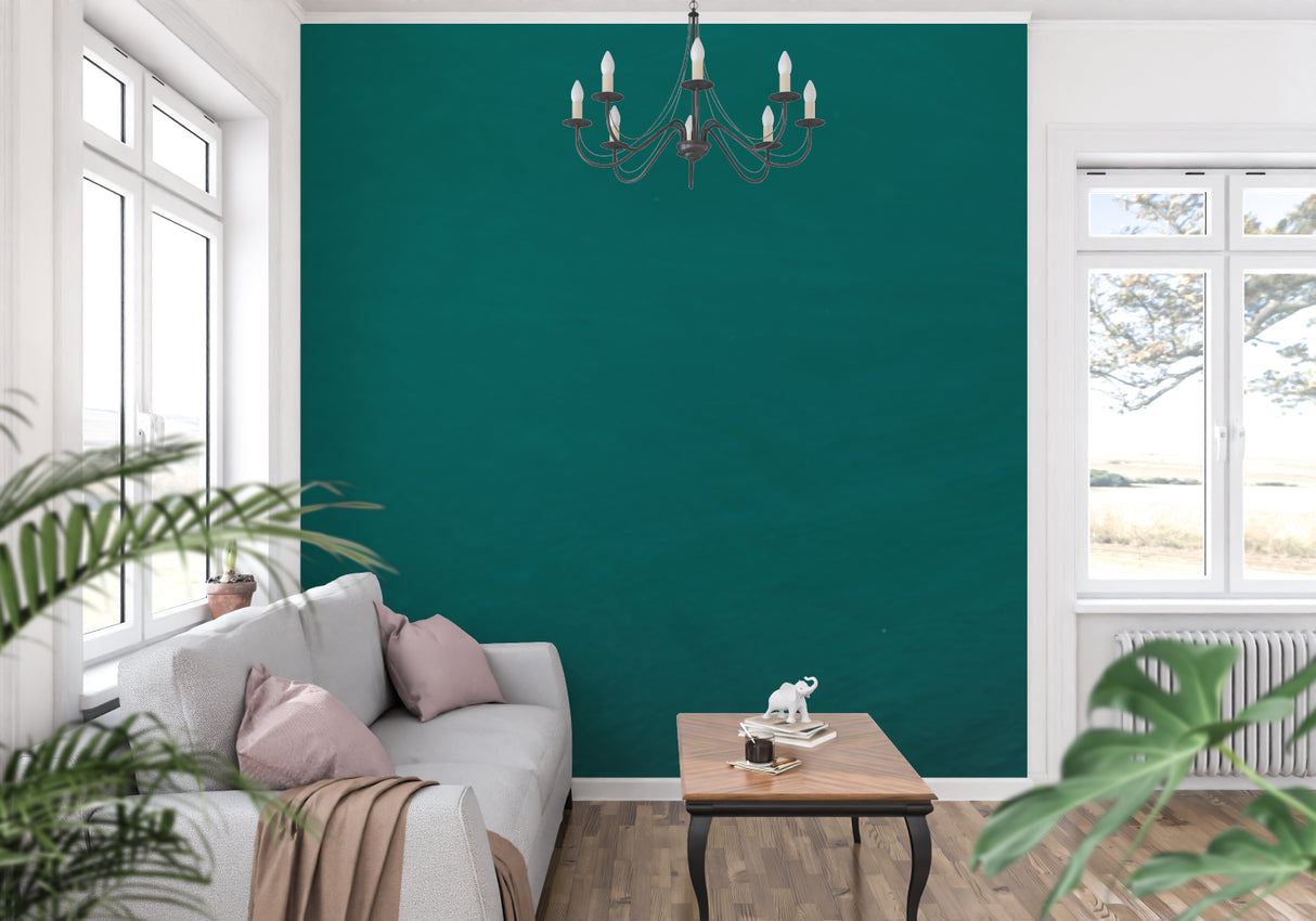 Modern green wallpaper in home office with wooden furniture
