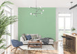 Modern minimalist green wallpaper in a bright living room with contemporary furniture