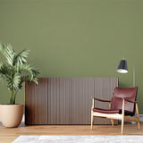 Green solid color wallpaper in contemporary dining room space